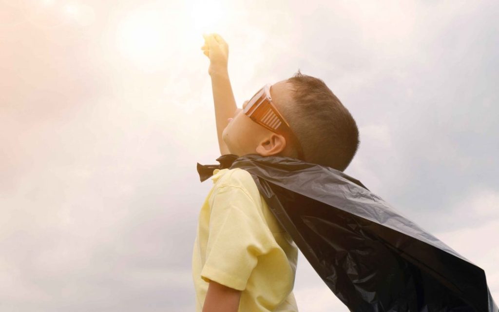 Young boy playing outdoors, representing what to expect when starting therapy